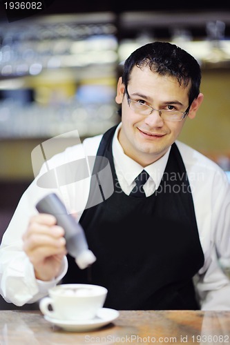 Image of Barista prepares cappuccino