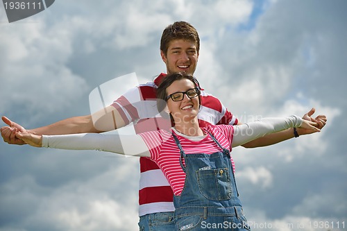 Image of romantic young couple in love together outdoor