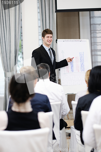 Image of Young  business man giving a presentation on conference