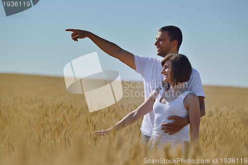 Image of happy couple in wheat field