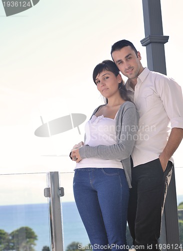 Image of couple relaxing on balcony