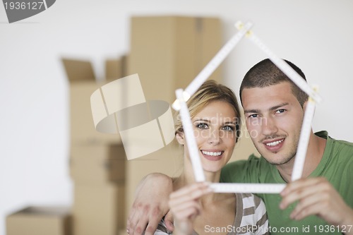 Image of Young couple moving in new home