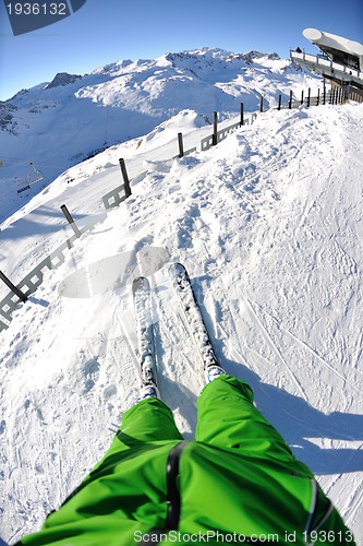 Image of skiing on fresh snow at winter season at beautiful sunny day