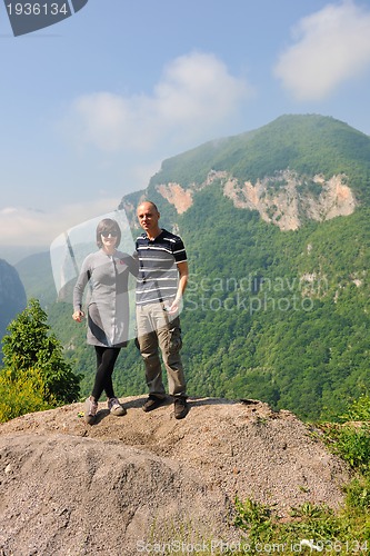 Image of happy young couple jumping in the air