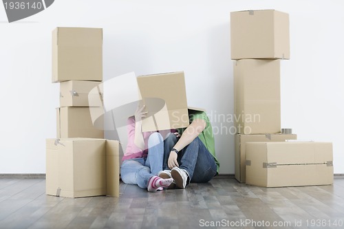 Image of Young couple moving in new home