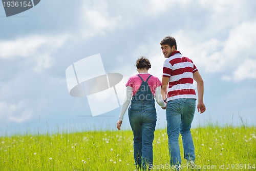 Image of romantic young couple in love together outdoor