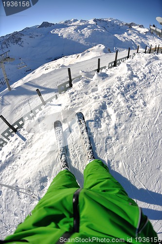 Image of skiing on fresh snow at winter season at beautiful sunny day