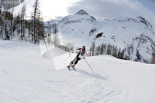 Image of skiing on fresh snow at winter season at beautiful sunny day