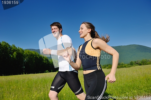 Image of Young couple jogging