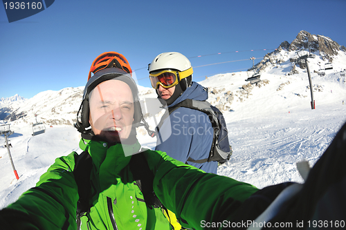 Image of winter portrait of friends at skiing