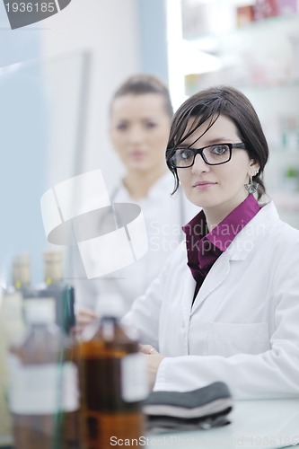 Image of team of pharmacist chemist woman  in pharmacy drugstore