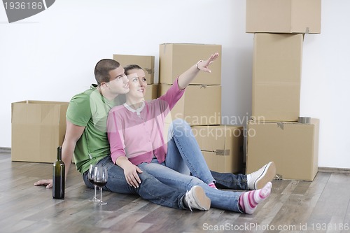 Image of Young couple moving in new home