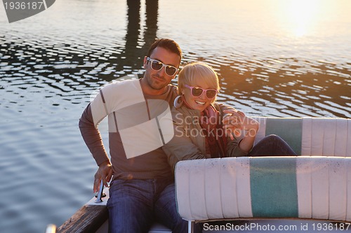 Image of couple in love  have romantic time on boat