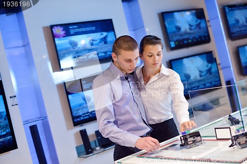 Image of people buy  in consumer electronics store