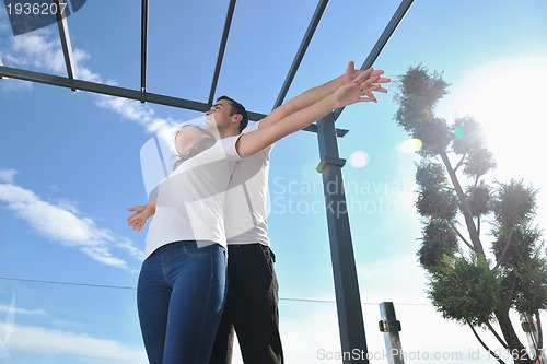 Image of couple relaxing on balcony