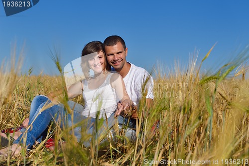 Image of happy couple in wheat field