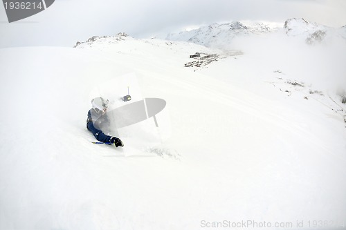 Image of skiing on fresh snow at winter season at beautiful sunny day