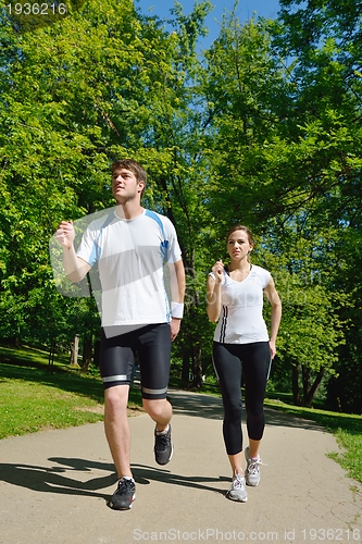 Image of Young couple jogging