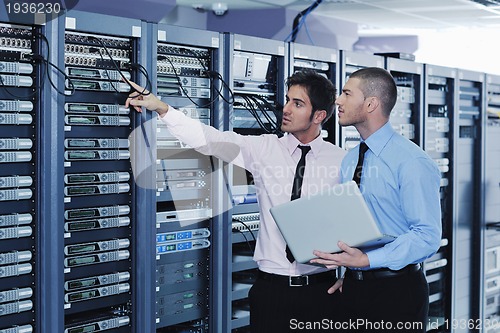 Image of it enineers in network server room