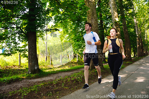 Image of Young couple jogging