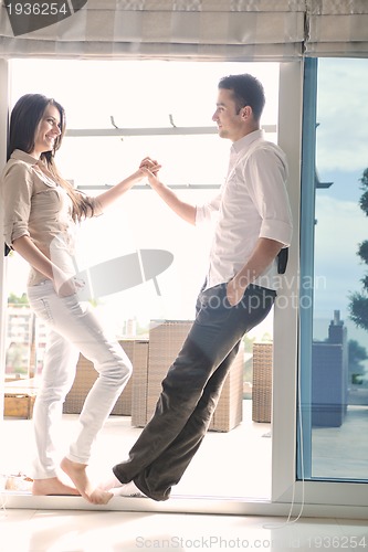 Image of couple relaxing on balcony