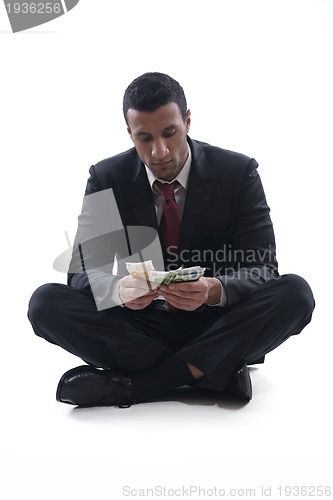 Image of Business man holding money