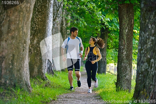 Image of Young couple jogging
