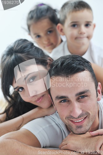 Image of happy young Family in their bedroom