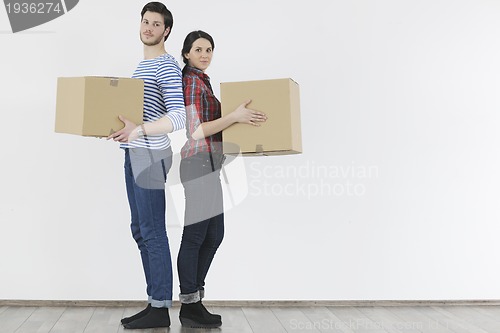 Image of Young couple moving in new home