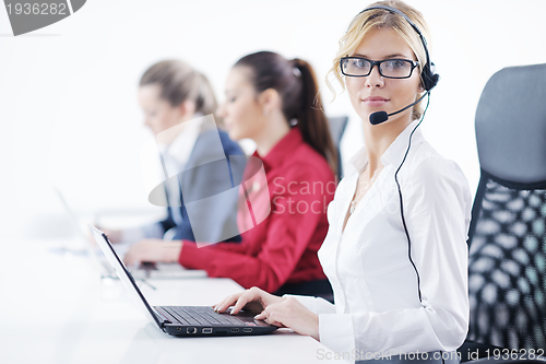 Image of business woman group with headphones