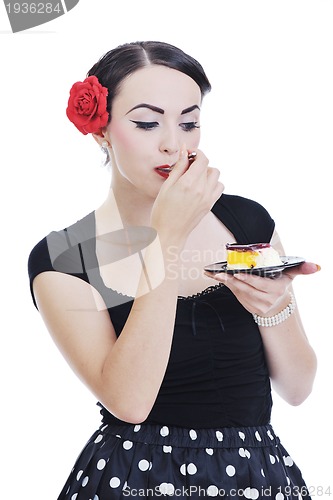 Image of beautiful young woman eat sweet cake