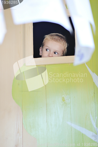 Image of happy child in a window