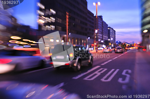 Image of City night with cars motion blurred light in busy street