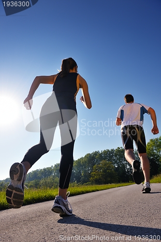 Image of Young couple jogging