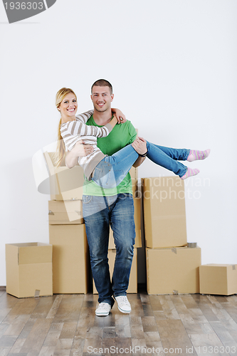 Image of Young couple moving in new house