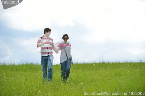 Image of romantic young couple in love together outdoor