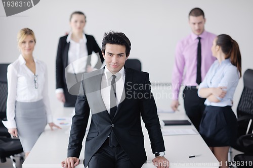 Image of young business man at meeting