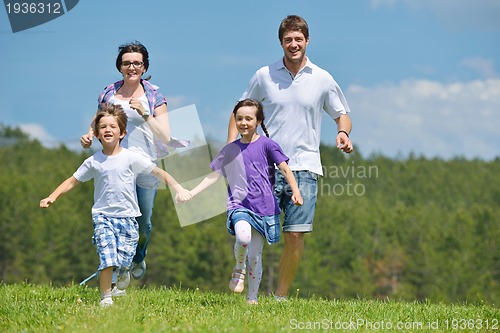 Image of happy young family have fun outdoors