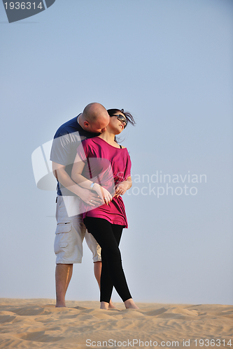 Image of couple enjoying the sunset