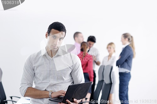 Image of young business man at meeting