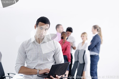 Image of young business man at meeting