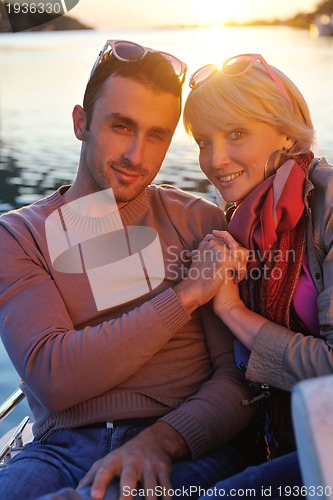 Image of couple in love  have romantic time on boat