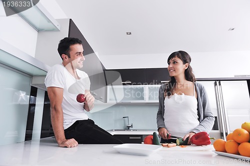 Image of young couple have fun in modern kitchen