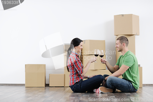 Image of Young couple moving in new house