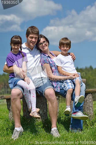 Image of happy young family have fun outdoors