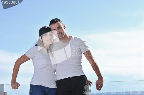 Image of couple relaxing on balcony
