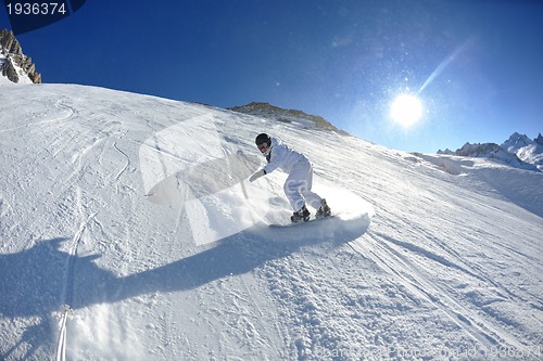 Image of skiing on fresh snow at winter season at beautiful sunny day