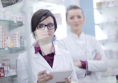 Image of team of pharmacist chemist woman  in pharmacy drugstore