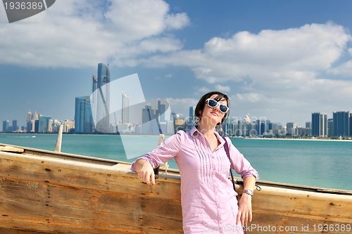 Image of happy tourist woman