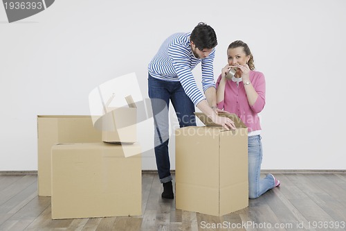 Image of Young couple moving in new home